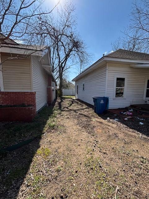 view of side of property featuring driveway