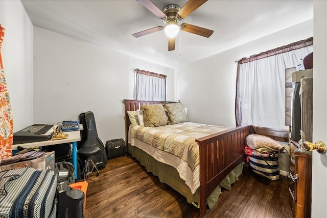 bedroom featuring a ceiling fan and wood finished floors