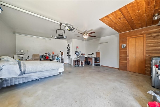 garage featuring a ceiling fan and wood ceiling