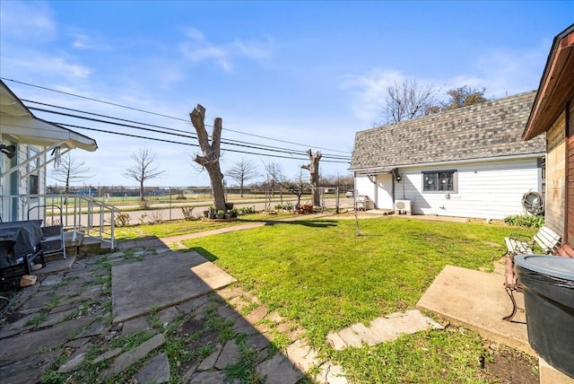 view of yard featuring a patio area and fence