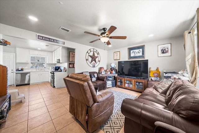 living room with light tile patterned flooring, visible vents, recessed lighting, and a ceiling fan