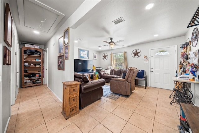 living room featuring visible vents, attic access, light tile patterned floors, recessed lighting, and a ceiling fan