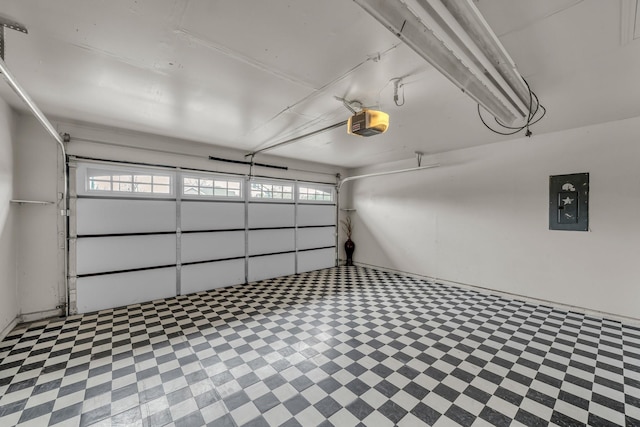 garage with electric panel and a garage door opener