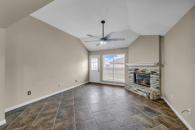 unfurnished living room featuring lofted ceiling, a fireplace, baseboards, and ceiling fan