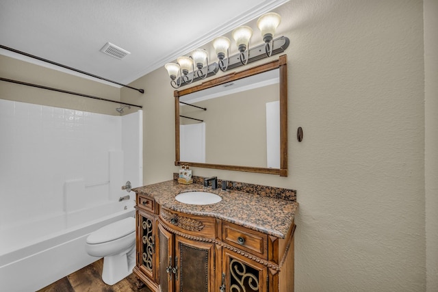 bathroom with visible vents, toilet, shower / washtub combination, wood finished floors, and vanity