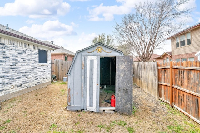 view of shed featuring a fenced backyard