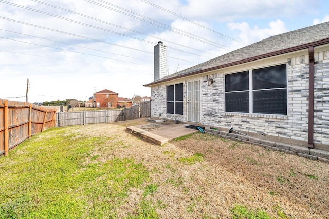 view of yard featuring a patio and a fenced backyard