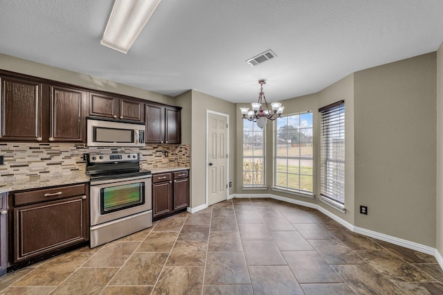 kitchen with dark brown cabinets, stainless steel appliances, visible vents, and an inviting chandelier