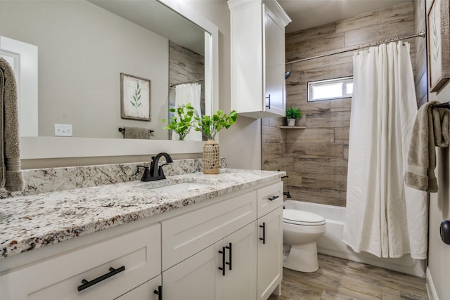 full bath featuring shower / bath combination with curtain, vanity, toilet, and wood finished floors