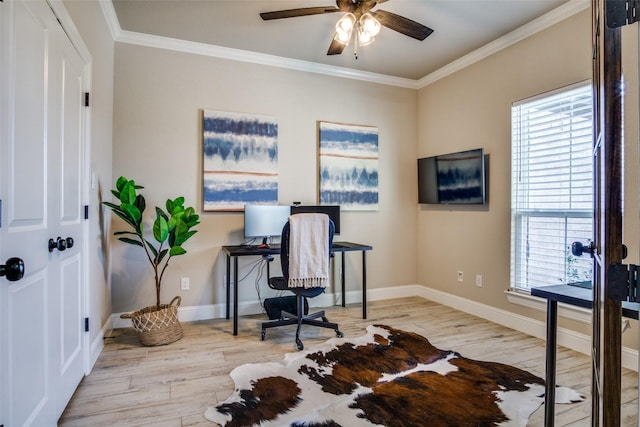 office space featuring ornamental molding, baseboards, ceiling fan, and wood finished floors