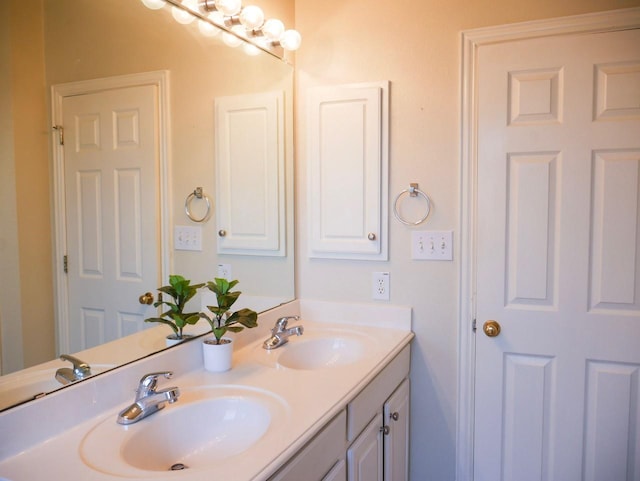 full bath featuring a sink and double vanity
