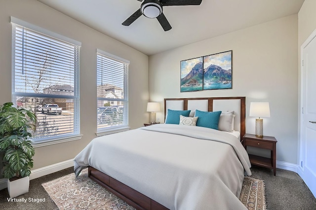 bedroom with carpet flooring, a ceiling fan, and baseboards