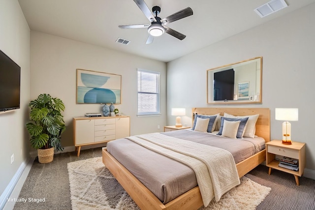 bedroom with visible vents, baseboards, carpet, and a ceiling fan