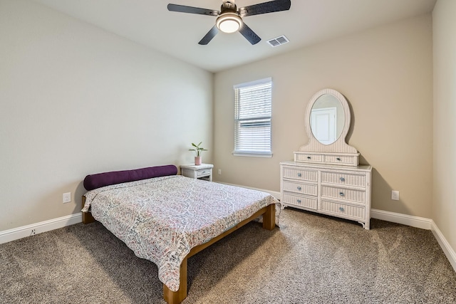 bedroom featuring visible vents, baseboards, ceiling fan, and carpet flooring