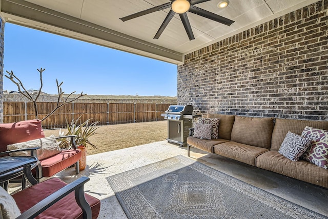 view of patio / terrace with outdoor lounge area, area for grilling, a fenced backyard, and a ceiling fan