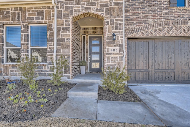 property entrance with brick siding and stone siding