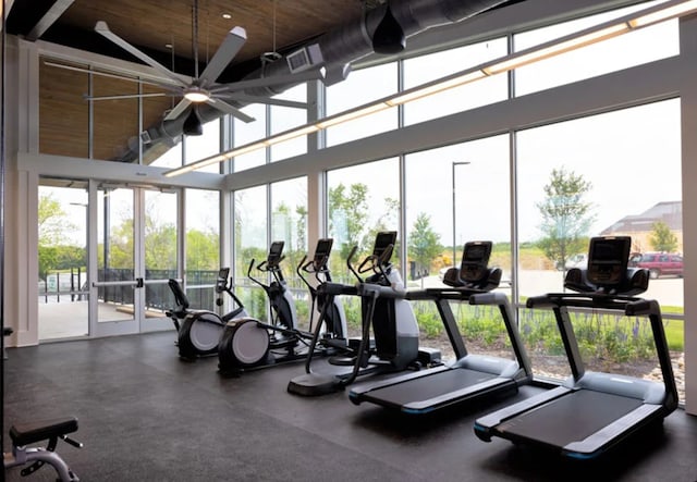 exercise room featuring visible vents and ceiling fan