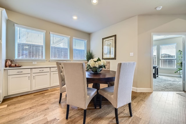 dining room featuring recessed lighting, baseboards, and light wood finished floors