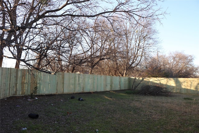 view of yard with a fenced backyard