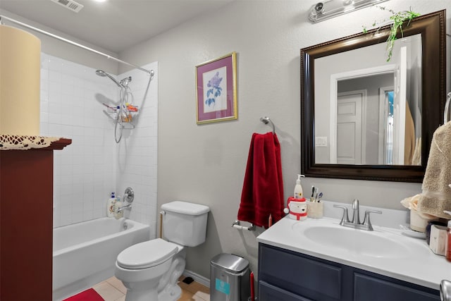 bathroom featuring vanity, baseboards, shower / bathing tub combination, toilet, and tile patterned floors