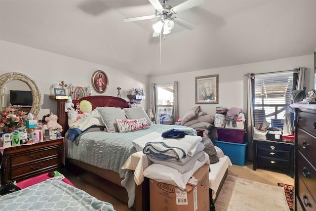 bedroom featuring light colored carpet and ceiling fan