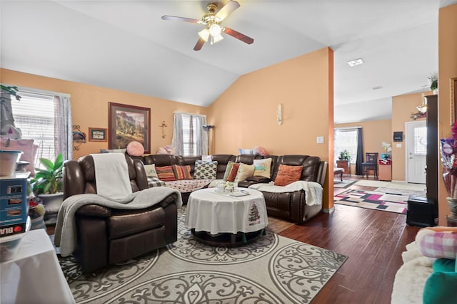 living room with ceiling fan, lofted ceiling, and wood finished floors