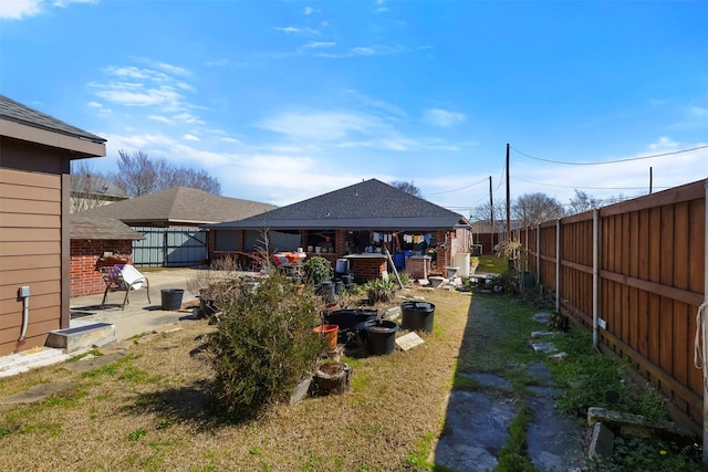 view of yard featuring a patio and fence