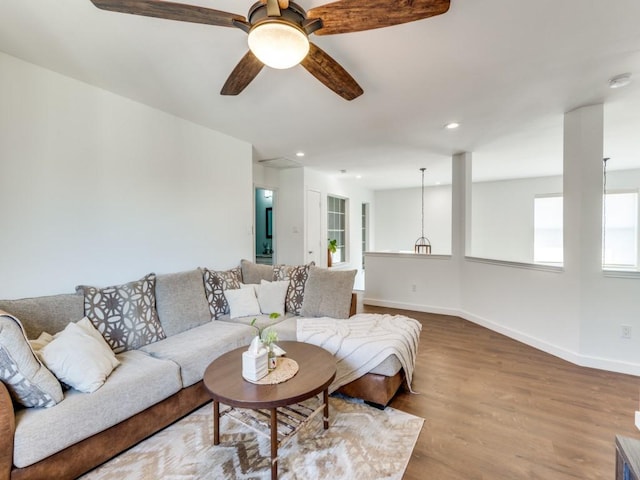 living room with recessed lighting, baseboards, wood finished floors, and a ceiling fan