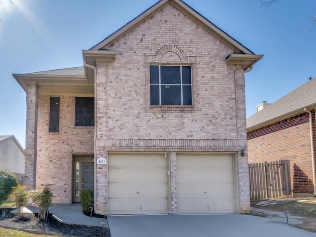 view of front of property featuring brick siding, concrete driveway, a garage, and fence