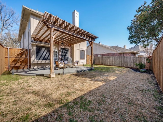 view of yard featuring a patio, a fenced backyard, and a pergola