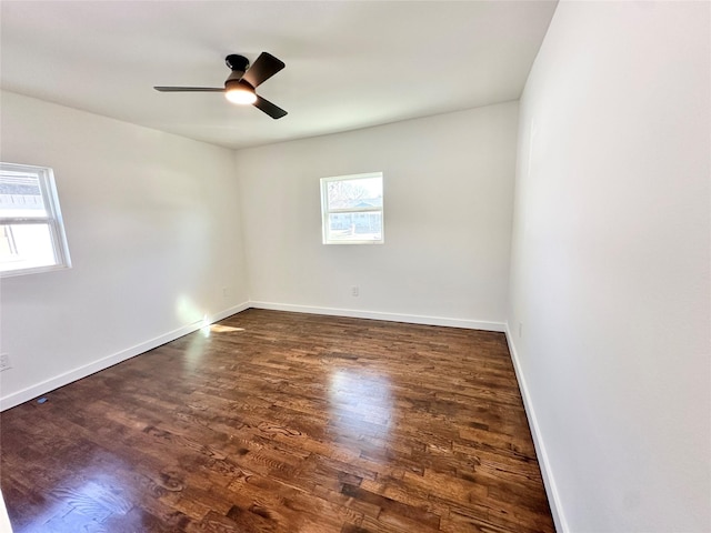 empty room featuring baseboards, a ceiling fan, and wood finished floors