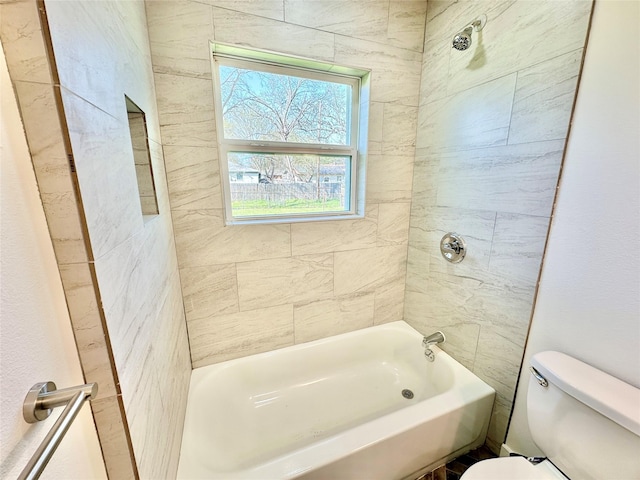 bathroom with toilet and shower / washtub combination