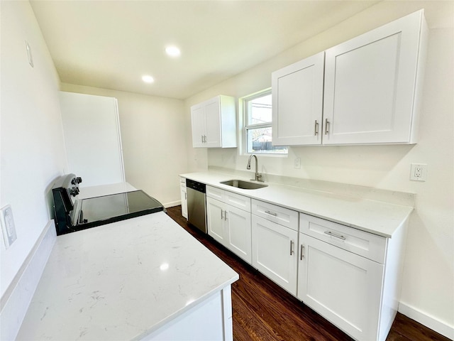 kitchen featuring stainless steel dishwasher, a sink, dark wood finished floors, white cabinetry, and electric stove