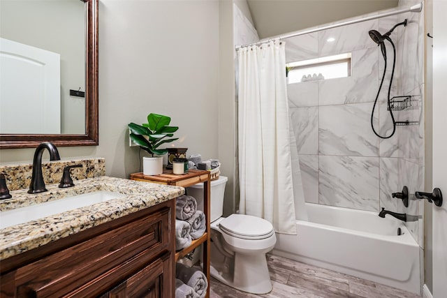 bathroom featuring shower / bathtub combination with curtain, toilet, wood finished floors, and vanity