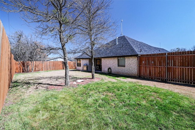 view of yard featuring a patio and a fenced backyard