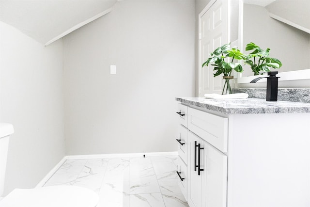 clothes washing area featuring marble finish floor, baseboards, and a sink