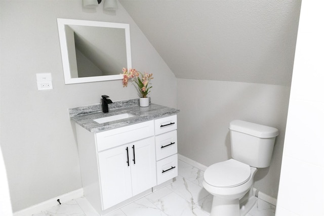 bathroom with baseboards, toilet, marble finish floor, and vanity