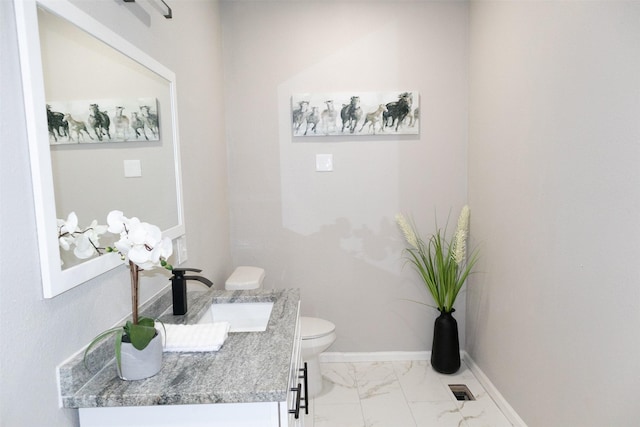 bathroom with visible vents, baseboards, toilet, marble finish floor, and vanity