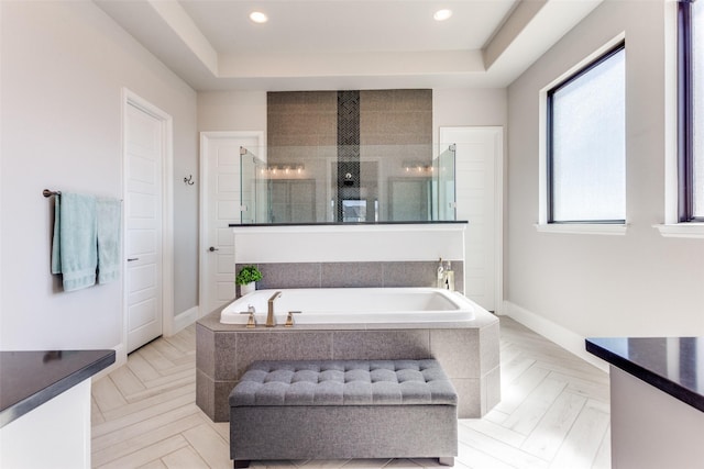 full bathroom featuring a shower stall, a garden tub, recessed lighting, and baseboards