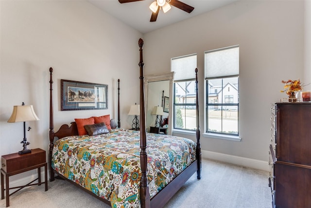 bedroom with baseboards, light colored carpet, and a ceiling fan