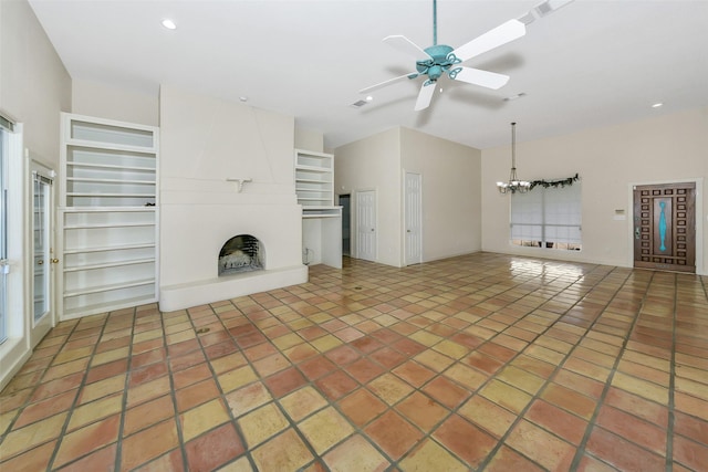 unfurnished living room featuring tile patterned floors, ceiling fan with notable chandelier, recessed lighting, a large fireplace, and vaulted ceiling