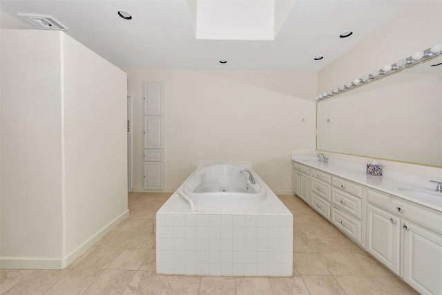 washroom with light tile patterned floors, baseboards, visible vents, and a sink