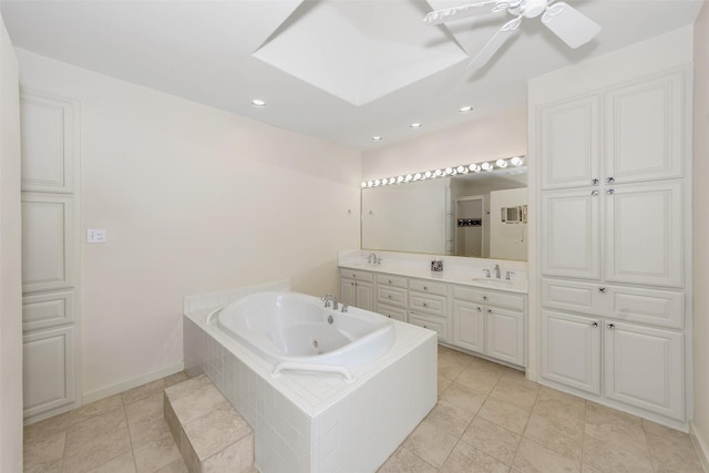 bathroom featuring a sink, a ceiling fan, a tub with jets, and double vanity