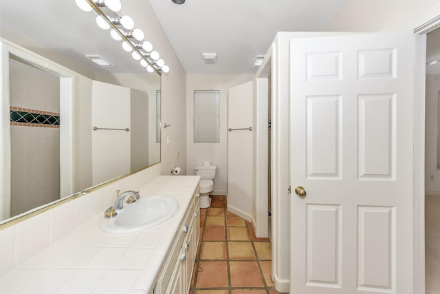 bathroom with visible vents, baseboards, toilet, and vanity