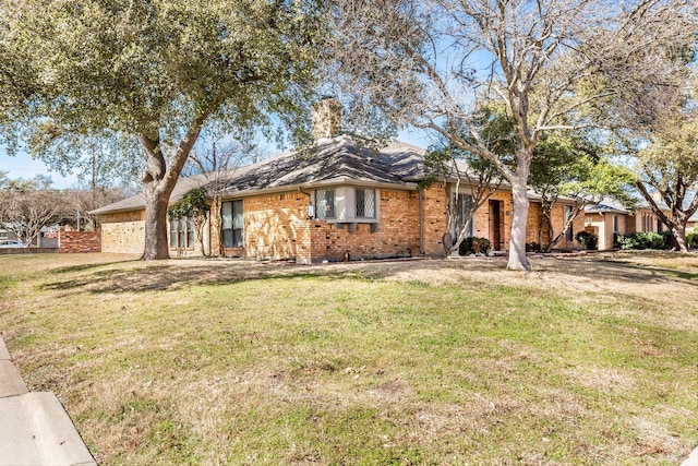 single story home featuring brick siding and a front lawn