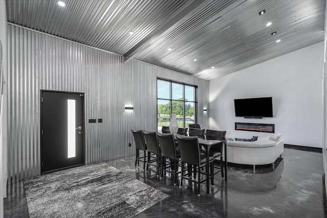 dining space with recessed lighting and concrete flooring