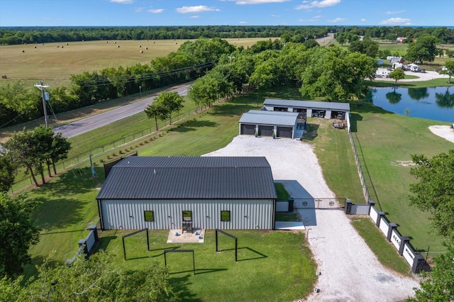 birds eye view of property with a rural view and a water view