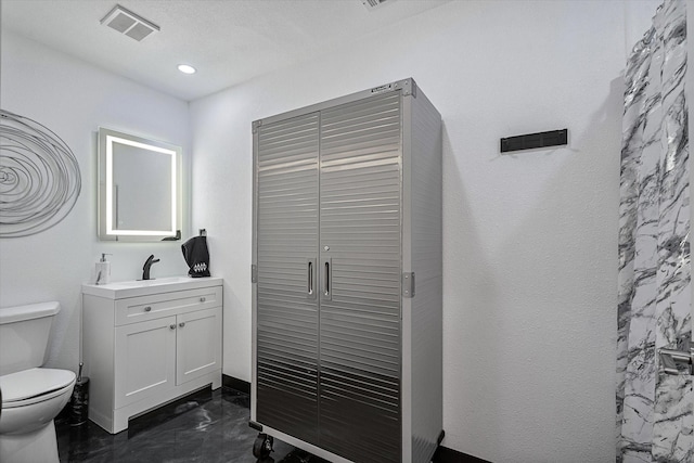 bathroom featuring visible vents, baseboards, toilet, recessed lighting, and vanity