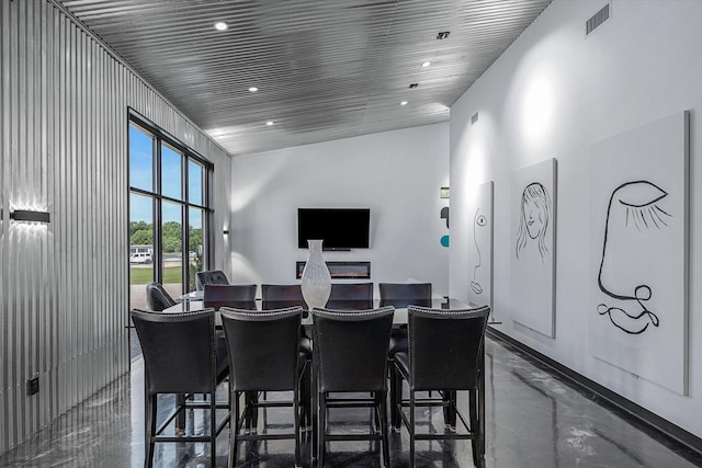 home theater room featuring recessed lighting, visible vents, and finished concrete flooring