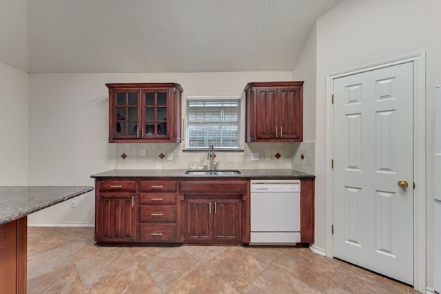 kitchen featuring decorative backsplash, dishwasher, glass insert cabinets, and a sink